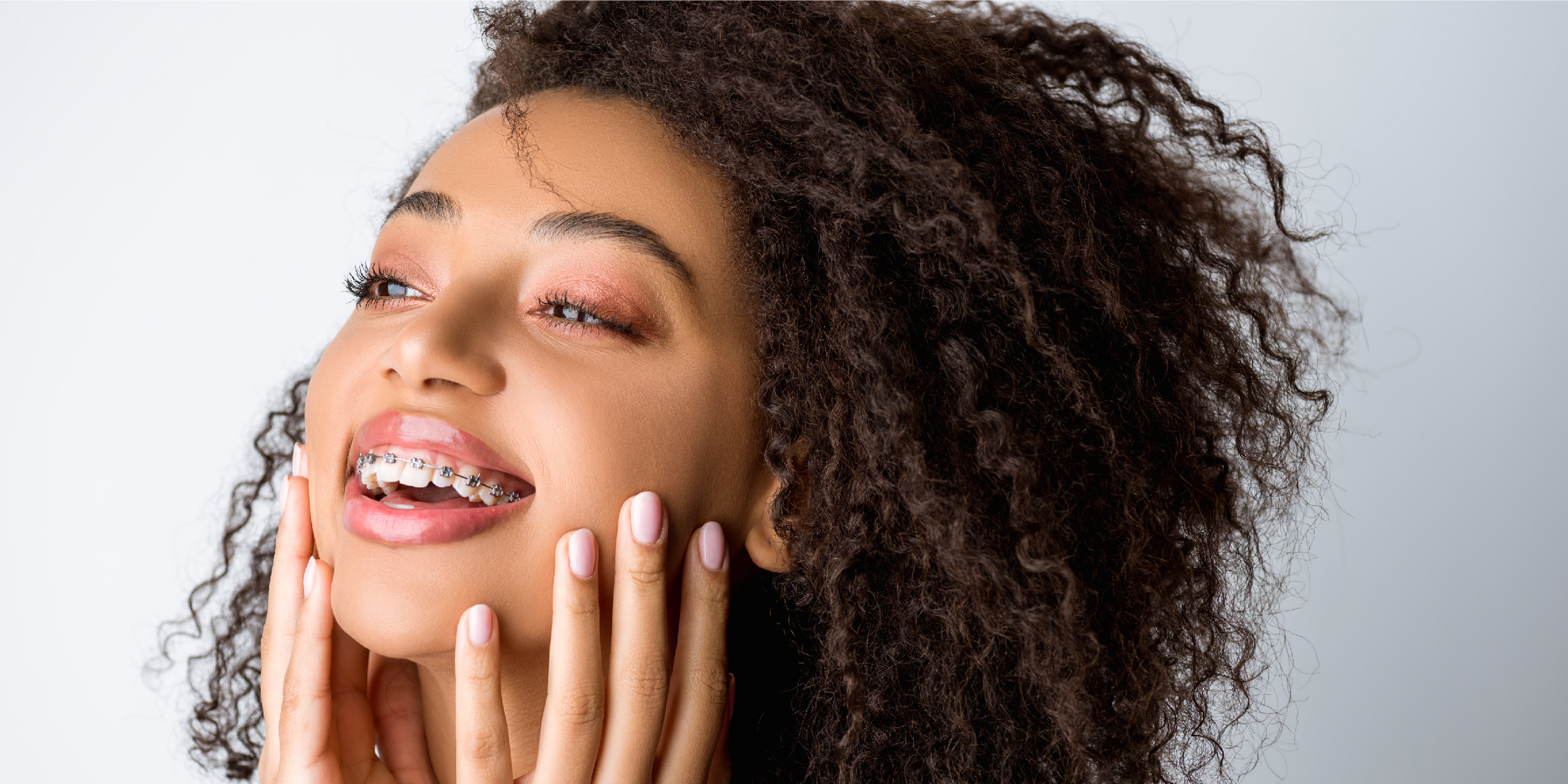 girl with curly hair and braces